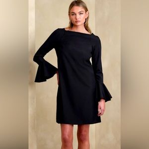 Black Crepe Mini Dress with Long sleeves and large ruffled cuffs.